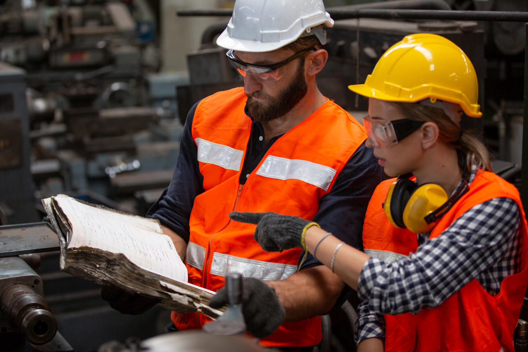 Engineers Operating a CNC Machine at the Factory