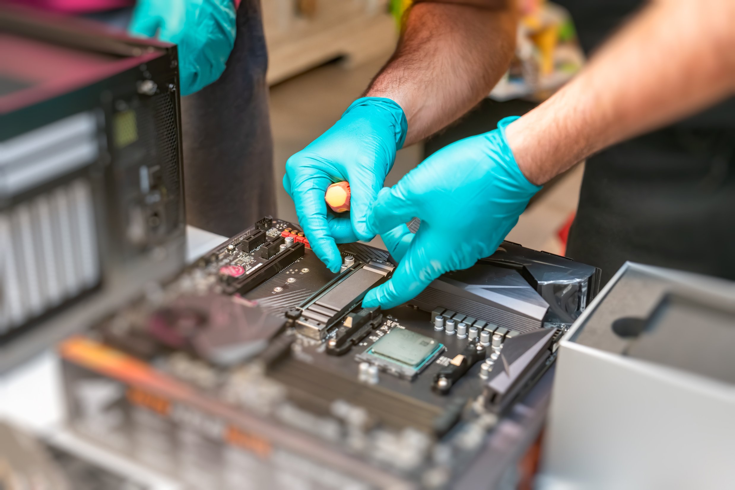 Technicians Repairing a Computer